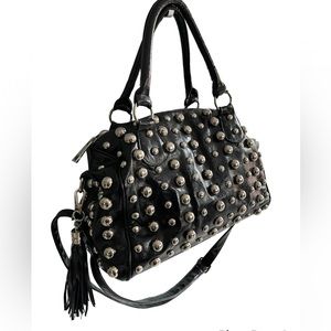 Black faux leather with stud embellishments. Inner material is leopard print.